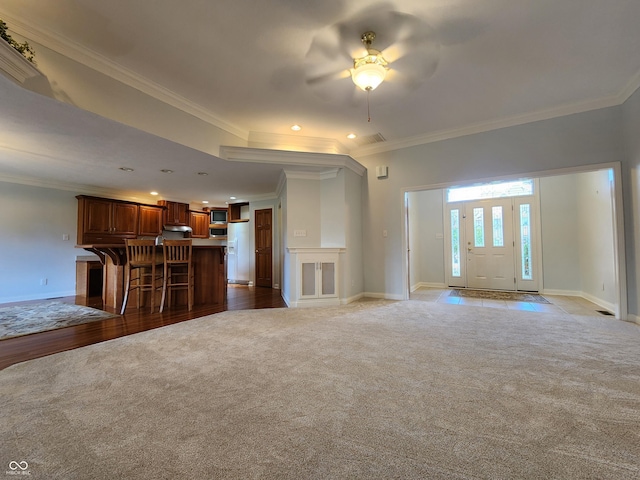 1633 Belfield St, Indianapolis, IN 46217 - unfurnished living room with light carpet, ceiling fan, ornamental molding, and recessed lighting