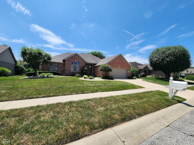 1633 Belfield St, Indianapolis, IN 46217 - ranch-style house with brick siding, driveway, a front yard, and a garage
