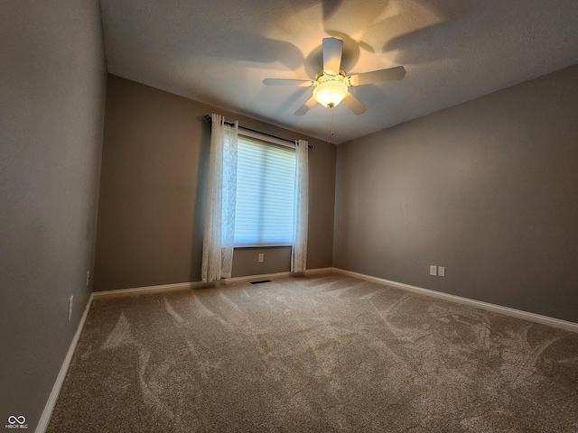 1633 Belfield St, Indianapolis, IN 46217 - carpeted spare room featuring baseboards and ceiling fan