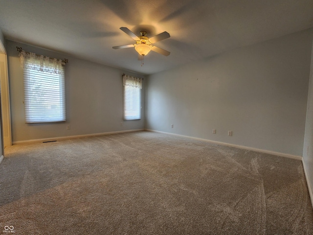1633 Belfield St, Indianapolis, IN 46217 - carpeted empty room featuring a ceiling fan and baseboards