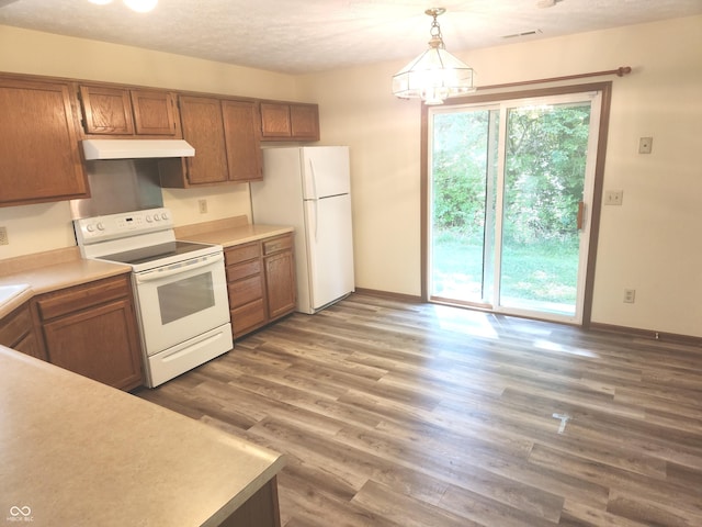 546 Grand Woods Dr, Indianapolis, IN 46224 - kitchen with white appliances, under cabinet range hood, light countertops, and brown cabinets