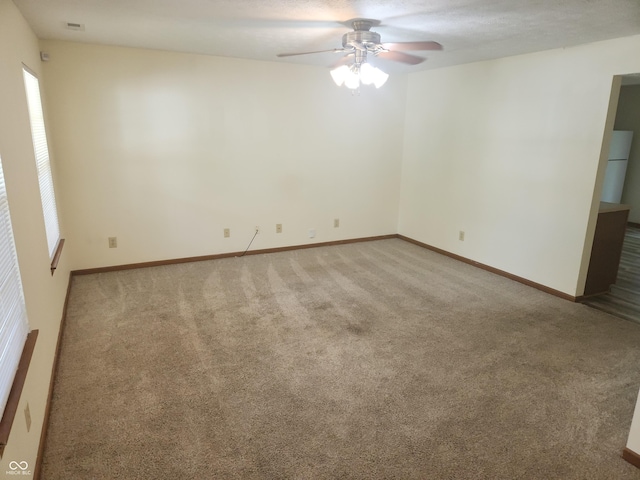 546 Grand Woods Dr, Indianapolis, IN 46224 - carpeted empty room featuring a ceiling fan and baseboards