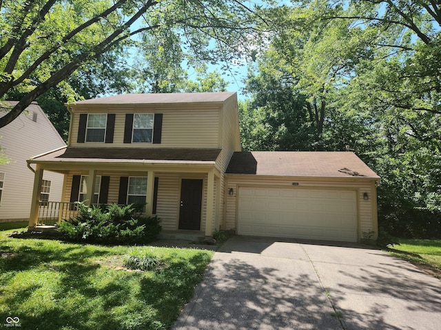 546 Grand Woods Dr, Indianapolis, IN 46224 - traditional home featuring a garage, concrete driveway, and covered porch