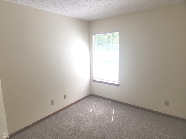 546 Grand Woods Dr, Indianapolis, IN 46224 - carpeted empty room featuring a textured ceiling and baseboards