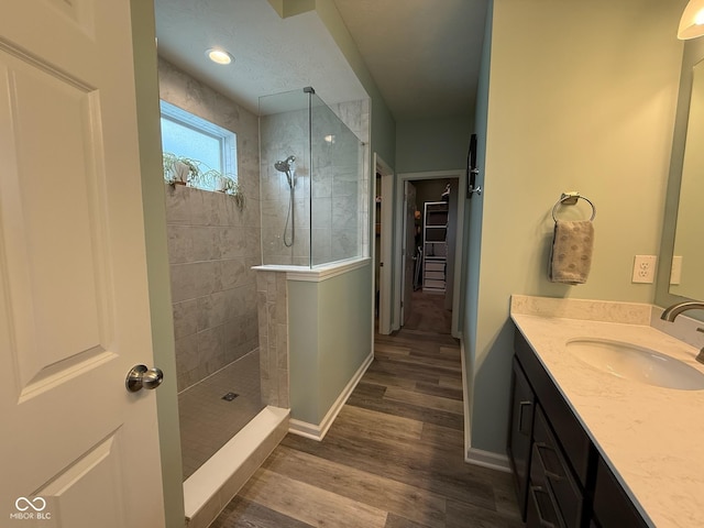 19280 Scofield Ridge Blvd, Westfield, IN 46062 - bathroom with vanity, walk in shower, wood finished floors, and a spacious closet