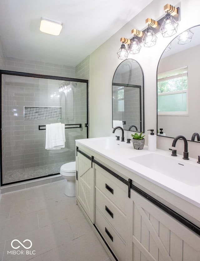 8650 Holliday Dr, Indianapolis, IN 46260 - full bath featuring double vanity, a shower stall, and tile patterned flooring