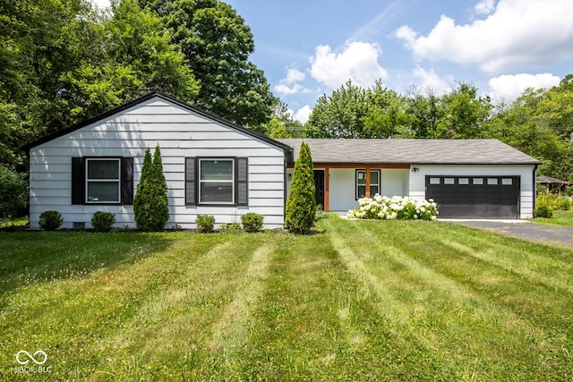 8650 Holliday Dr, Indianapolis, IN 46260 - single story home featuring driveway, an attached garage, and a front lawn