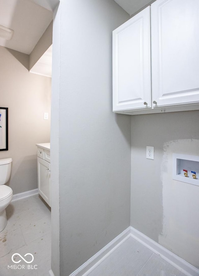 8650 Holliday Dr, Indianapolis, IN 46260 - washroom featuring baseboards and hookup for a washing machine