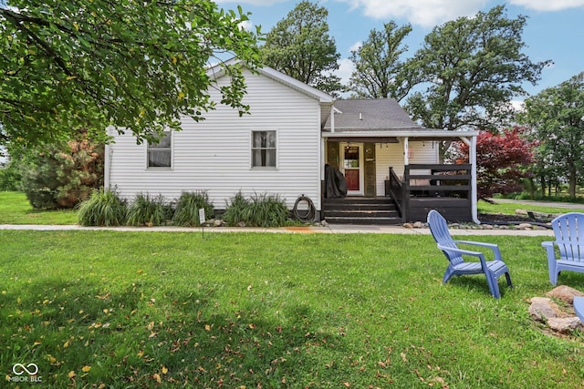 26735 Six Points Rd, Sheridan, IN 46069 - back of house featuring a yard, a shingled roof, and a wooden deck