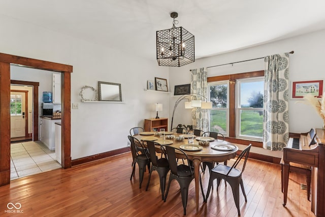26735 Six Points Rd, Sheridan, IN 46069 - dining room with a chandelier and light wood-style flooring
