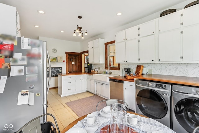 26735 Six Points Rd, Sheridan, IN 46069 - laundry room with independent washer and dryer, light tile patterned floors, and recessed lighting
