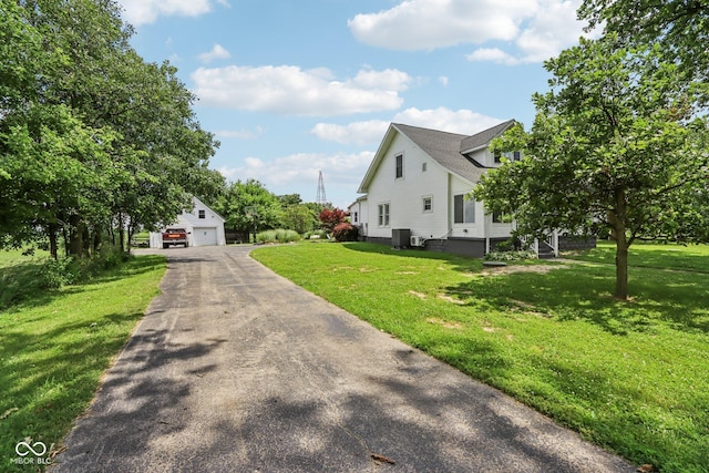 26735 Six Points Rd, Sheridan, IN 46069 - view of front of house featuring a front yard, a garage, and an outdoor structure