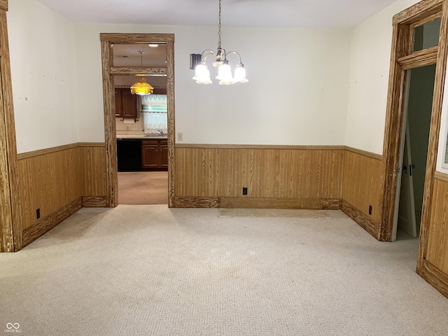 236 N Maple St, Dana, IN 47847 - unfurnished room with a wainscoted wall, a chandelier, light carpet, and wood walls