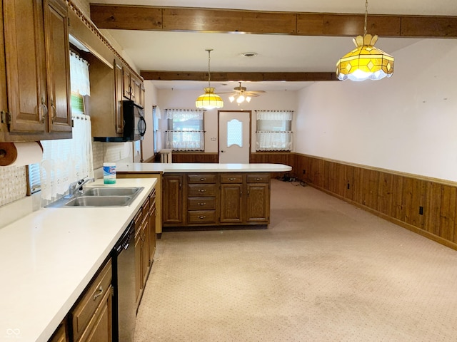 236 N Maple St, Dana, IN 47847 - kitchen featuring beam ceiling, light countertops, a wainscoted wall, dishwashing machine, and a peninsula