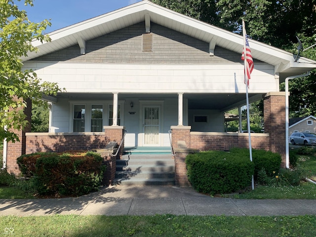 236 N Maple St, Dana, IN 47847 - bungalow-style house with covered porch and brick siding