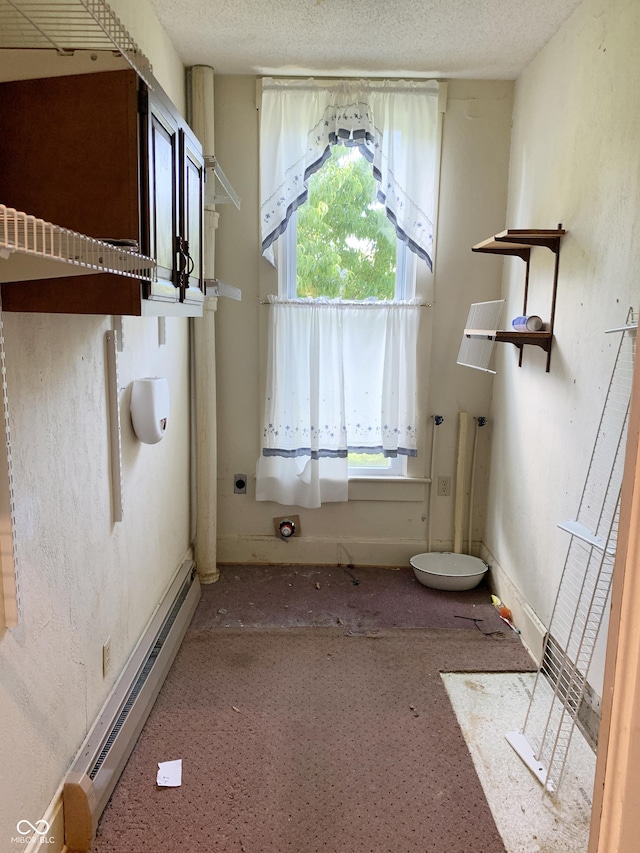236 N Maple St, Dana, IN 47847 - bathroom featuring baseboard heating and a textured ceiling