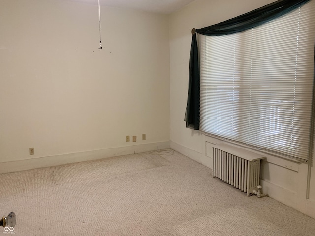 236 N Maple St, Dana, IN 47847 - carpeted spare room featuring radiator