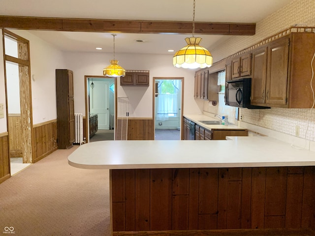 236 N Maple St, Dana, IN 47847 - kitchen featuring radiator heating unit, wainscoting, a peninsula, light countertops, and beamed ceiling