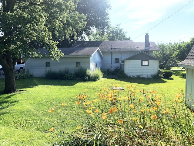236 N Maple St, Dana, IN 47847 - back of property with a chimney and a lawn