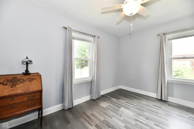 1336 N Butler Ave, Indianapolis, IN 46219 - spare room featuring plenty of natural light, wood finished floors, and a ceiling fan