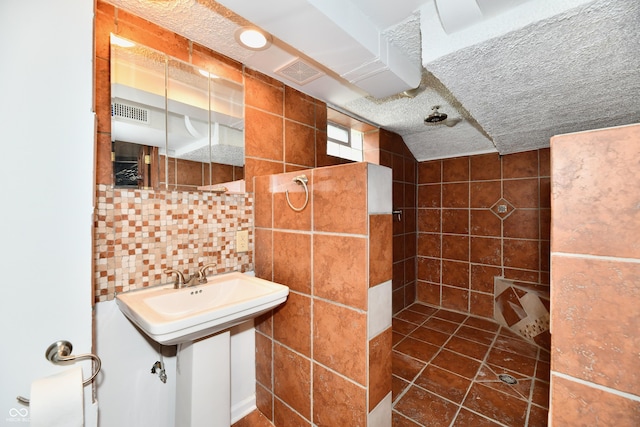 1336 N Butler Ave, Indianapolis, IN 46219 - full bathroom featuring a walk in shower, tile walls, and backsplash