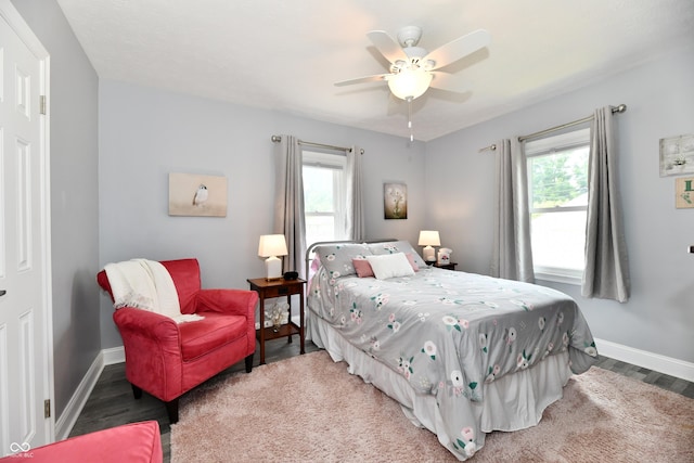 1336 N Butler Ave, Indianapolis, IN 46219 - bedroom featuring multiple windows, wood finished floors, and ceiling fan