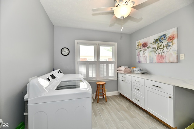 1336 N Butler Ave, Indianapolis, IN 46219 - laundry area featuring washer and dryer, cabinet space, light wood-style flooring, and ceiling fan