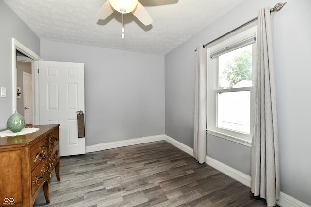 1336 N Butler Ave, Indianapolis, IN 46219 - bedroom featuring wood finished floors, a textured ceiling, and a ceiling fan
