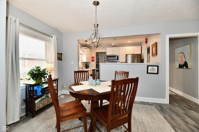 1336 N Butler Ave, Indianapolis, IN 46219 - dining area featuring wood finished floors and a chandelier