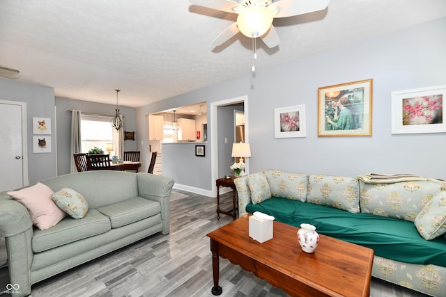 1336 N Butler Ave, Indianapolis, IN 46219 - living area with ceiling fan, wood finished floors, and a textured ceiling