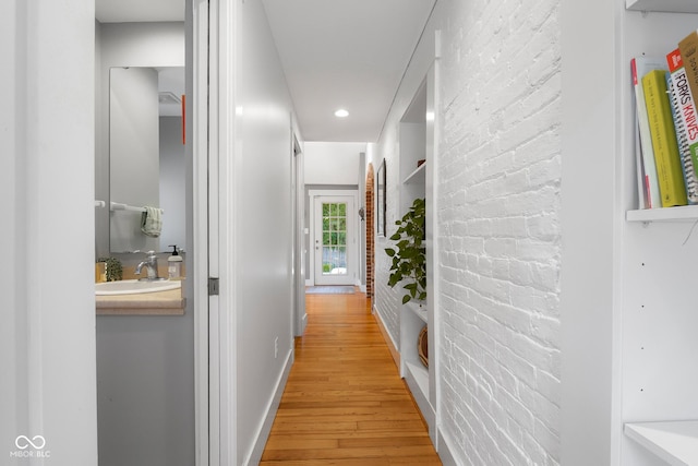 4224 River Rd, Columbus, IN 47203 - hall with light wood-style flooring, brick wall, and recessed lighting