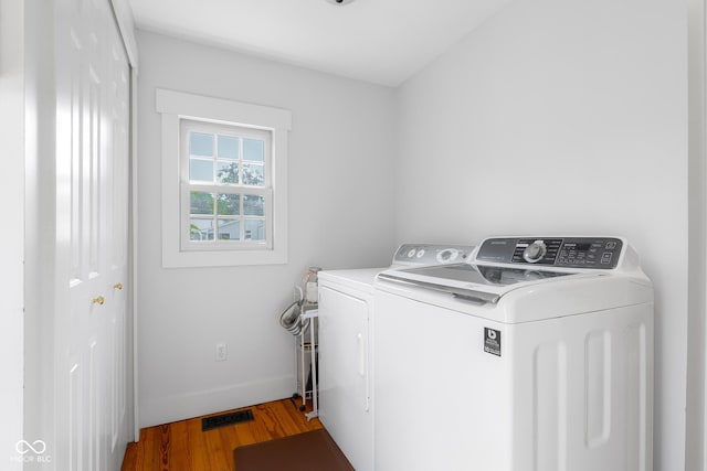 4224 River Rd, Columbus, IN 47203 - laundry area with washing machine and clothes dryer and wood finished floors