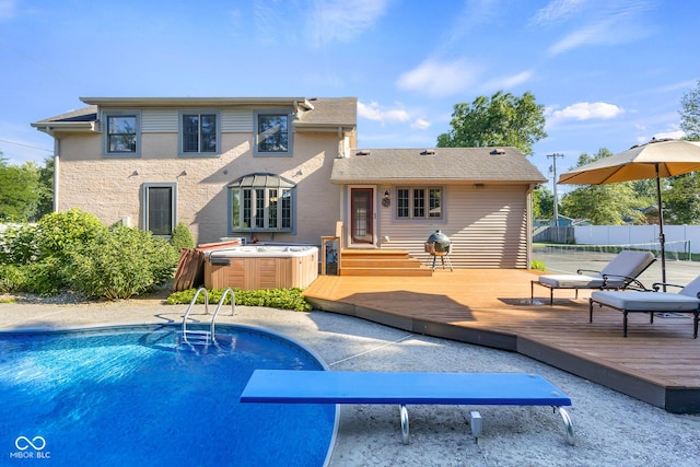 4224 River Rd, Columbus, IN 47203 - rear view of house featuring a hot tub and a deck