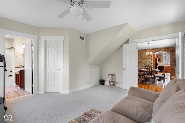 4224 River Rd, Columbus, IN 47203 - living area featuring ceiling fan, light carpet, and a chandelier