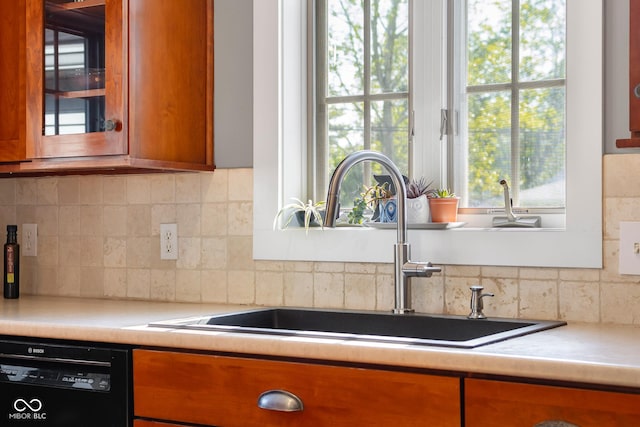 4224 River Rd, Columbus, IN 47203 - kitchen with dishwasher, brown cabinets, and tasteful backsplash