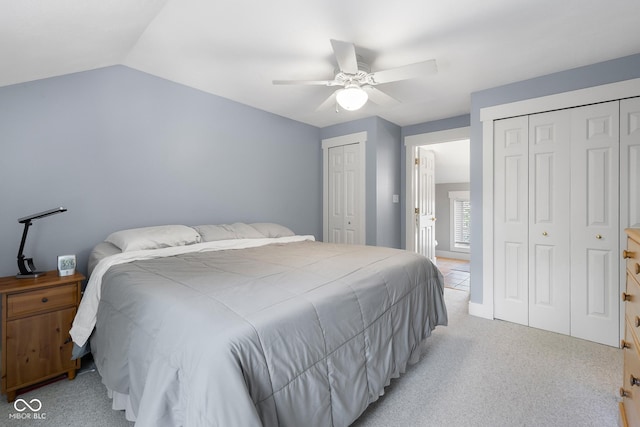 4224 River Rd, Columbus, IN 47203 - bedroom featuring multiple closets, light colored carpet, lofted ceiling, and a ceiling fan