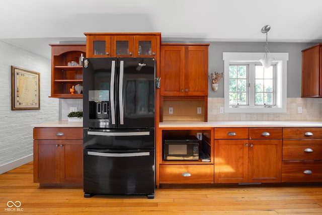 4224 River Rd, Columbus, IN 47203 - kitchen featuring black appliances, open shelves, light countertops, decorative backsplash, and light wood-style floors