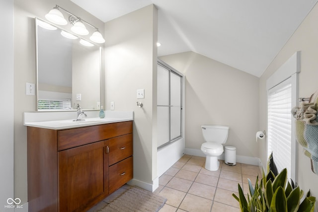 4224 River Rd, Columbus, IN 47203 - bathroom featuring vaulted ceiling, vanity, enclosed tub / shower combo, and tile patterned flooring