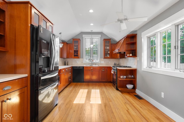 4224 River Rd, Columbus, IN 47203 - kitchen with open shelves, black appliances, brown cabinets, plenty of natural light, and lofted ceiling
