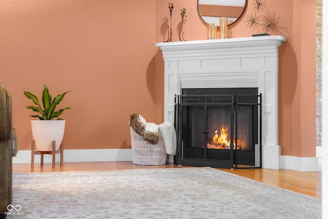 4224 River Rd, Columbus, IN 47203 - detailed view of a warm lit fireplace and wood finished floors