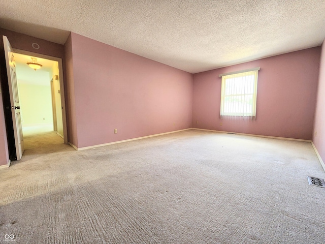 4501 N Wheeling Ave # 5E4, Muncie, IN 47304 - spare room featuring carpet flooring and a textured ceiling