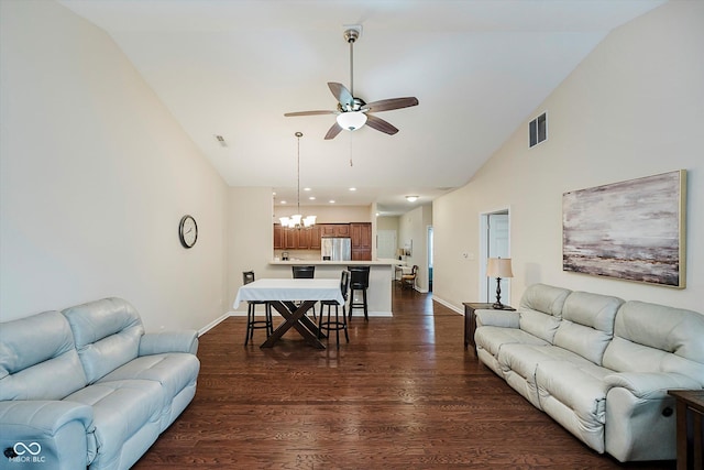 5651 Jones Dr, Plainfield, IN 46168 - living room featuring a ceiling fan, vaulted ceiling, dark wood-style flooring, a chandelier, and recessed lighting