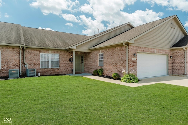 5651 Jones Dr, Plainfield, IN 46168 - ranch-style house featuring brick siding, an attached garage, a front lawn, and roof with shingles