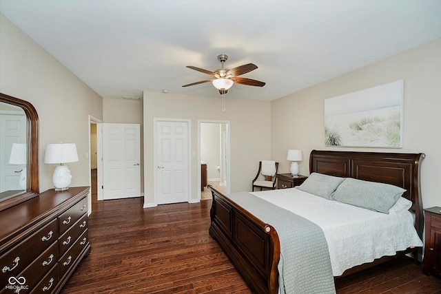 5651 Jones Dr, Plainfield, IN 46168 - bedroom with dark wood-style flooring, a ceiling fan, and connected bathroom