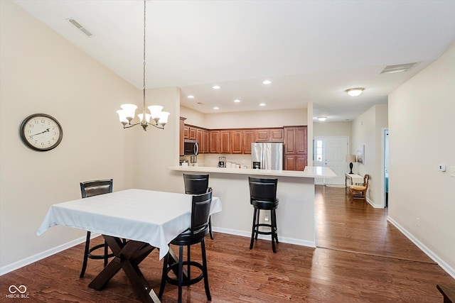 5651 Jones Dr, Plainfield, IN 46168 - dining room with dark wood-style flooring, recessed lighting, and a chandelier