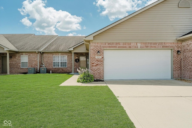 5651 Jones Dr, Plainfield, IN 46168 - view of front facade with brick siding, concrete driveway, a front yard, an attached garage, and roof with shingles