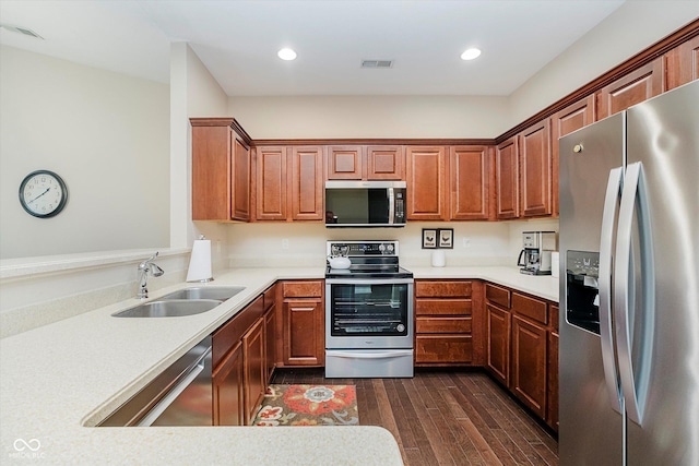 5651 Jones Dr, Plainfield, IN 46168 - kitchen featuring stainless steel appliances, dark wood-type flooring, light countertops, recessed lighting, and a peninsula