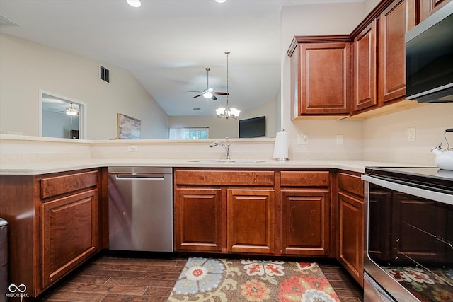 5651 Jones Dr, Plainfield, IN 46168 - kitchen with appliances with stainless steel finishes, a ceiling fan, light countertops, lofted ceiling, and dark wood-type flooring