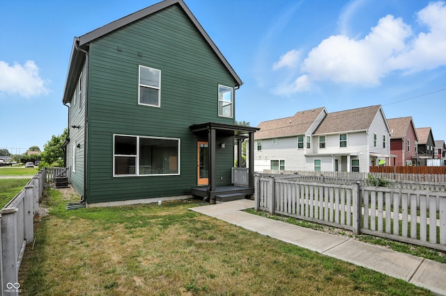1905 Cornell Ave, Indianapolis, IN 46202 - rear view of house featuring a fenced backyard and a residential view