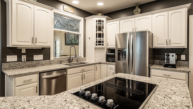 295 Watershed Ct, Noblesville, IN 46062 - kitchen featuring appliances with stainless steel finishes, white cabinetry, recessed lighting, and light stone counters